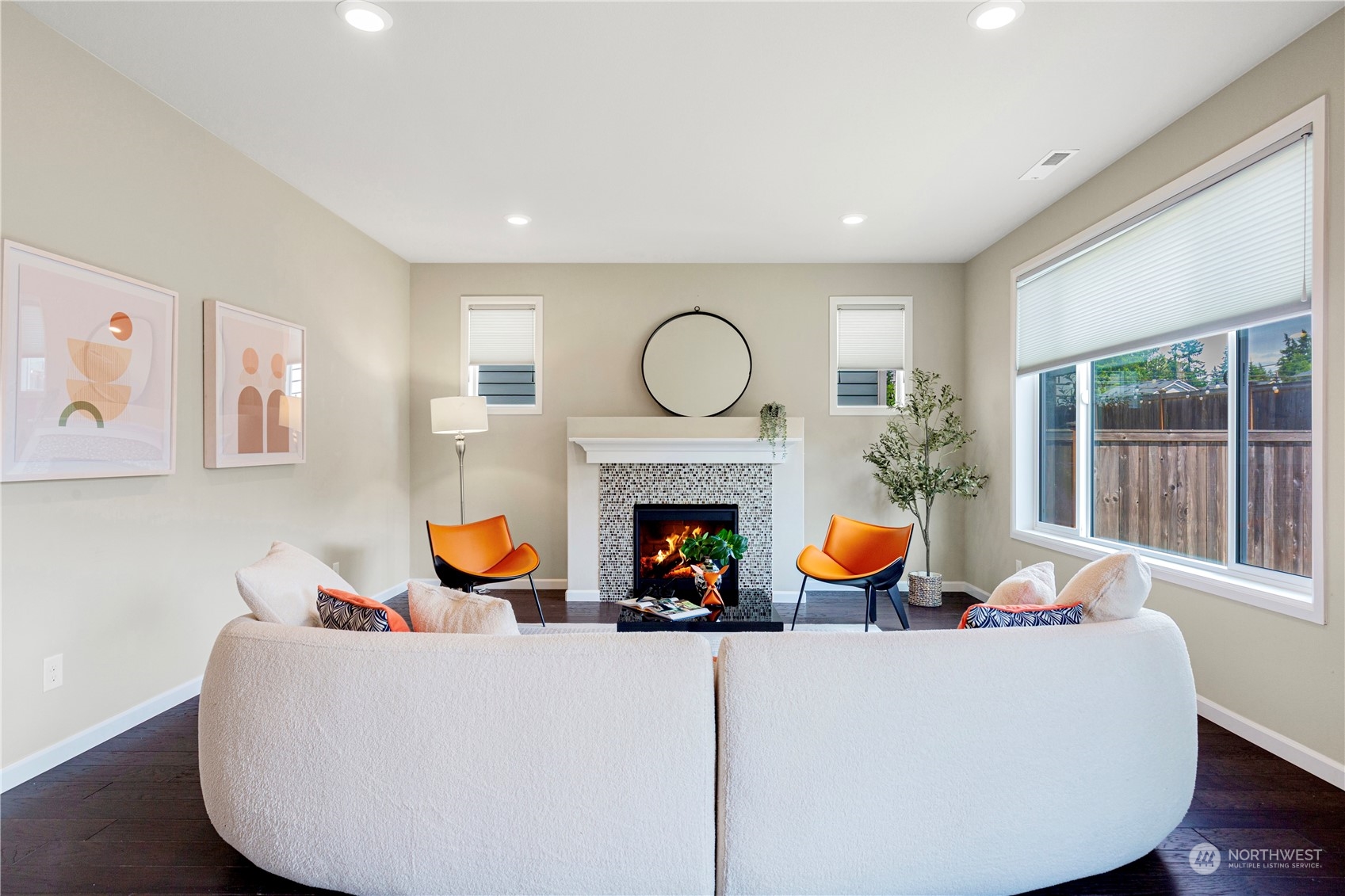21311 42nd Avenue Southeast Bothell, WA 98021 - Photo 4 of 24 a living room with furniture a fireplace and blue walls