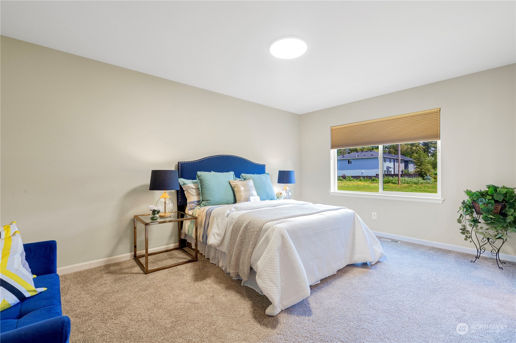 21311 42nd Avenue Southeast Bothell, WA 98021 - Photo 9 of 24 a spacious bedroom with a bed and a painting on the wall