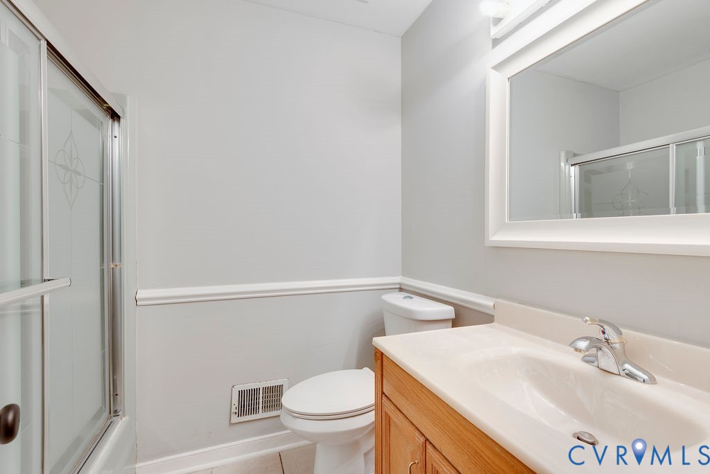 8510 Hunton Circle North Chesterfield, VA 23235 - Photo 11 of 32 a bathroom with a sink a toilet and vanity