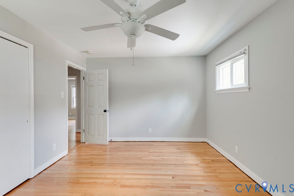 8510 Hunton Circle North Chesterfield, VA 23235 - Photo 12 of 32 an empty room with wooden floor and windows