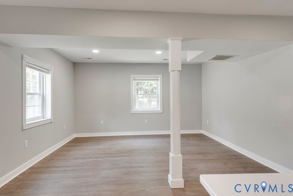 8510 Hunton Circle North Chesterfield, VA 23235 - Photo 20 of 32 an empty room with wooden floor and windows