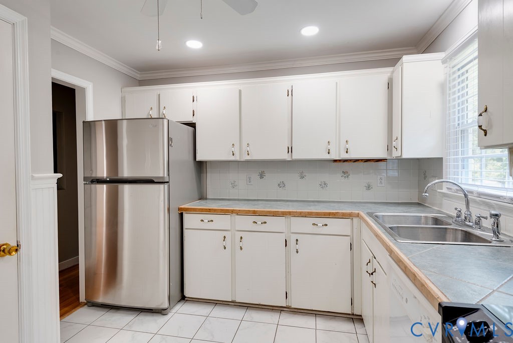 8510 Hunton Circle North Chesterfield, VA 23235 - Photo 10 of 32 a kitchen with white cabinets and refrigerator