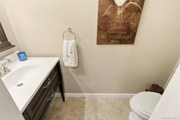 a bathroom with a sink toilet and tub