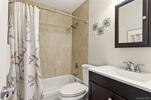 a bathroom with a sink a toilet and a bathtub