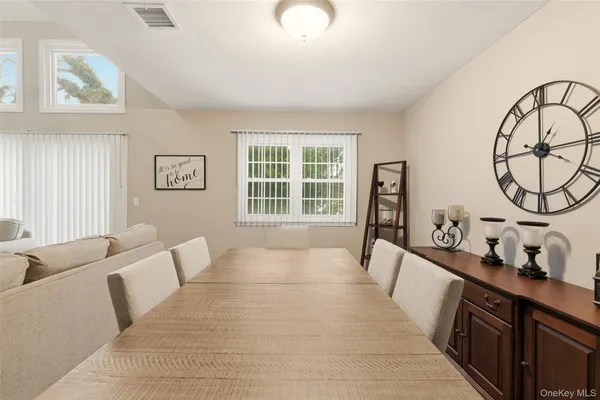 a spacious bedroom with a large bed and a window