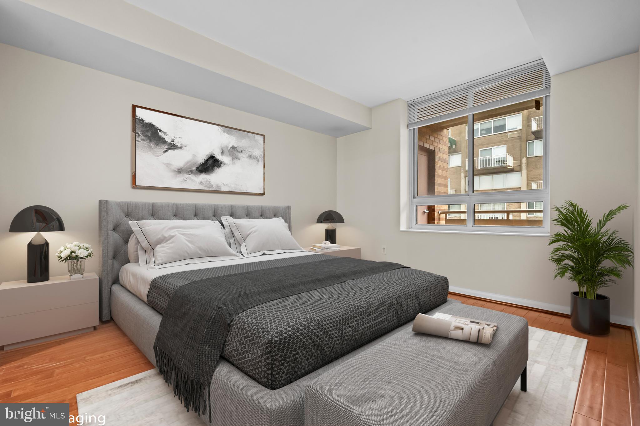 350 G Street Southwest, Unit N614 Washington, DC 20024 - Photo 12 of 35 a bedroom with a large bed and a window