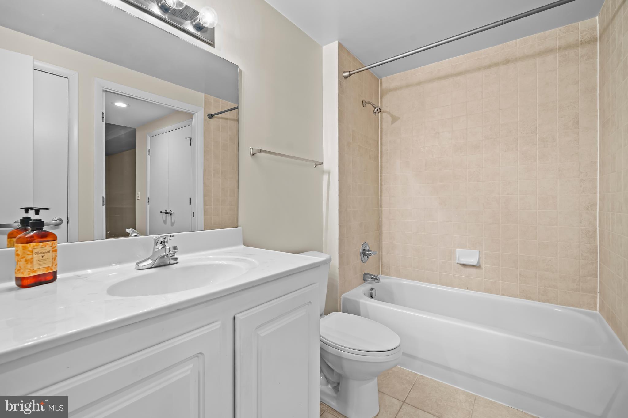 350 G Street Southwest, Unit N614 Washington, DC 20024 - Photo 15 of 35 a bathroom with a sink a toilet and shower