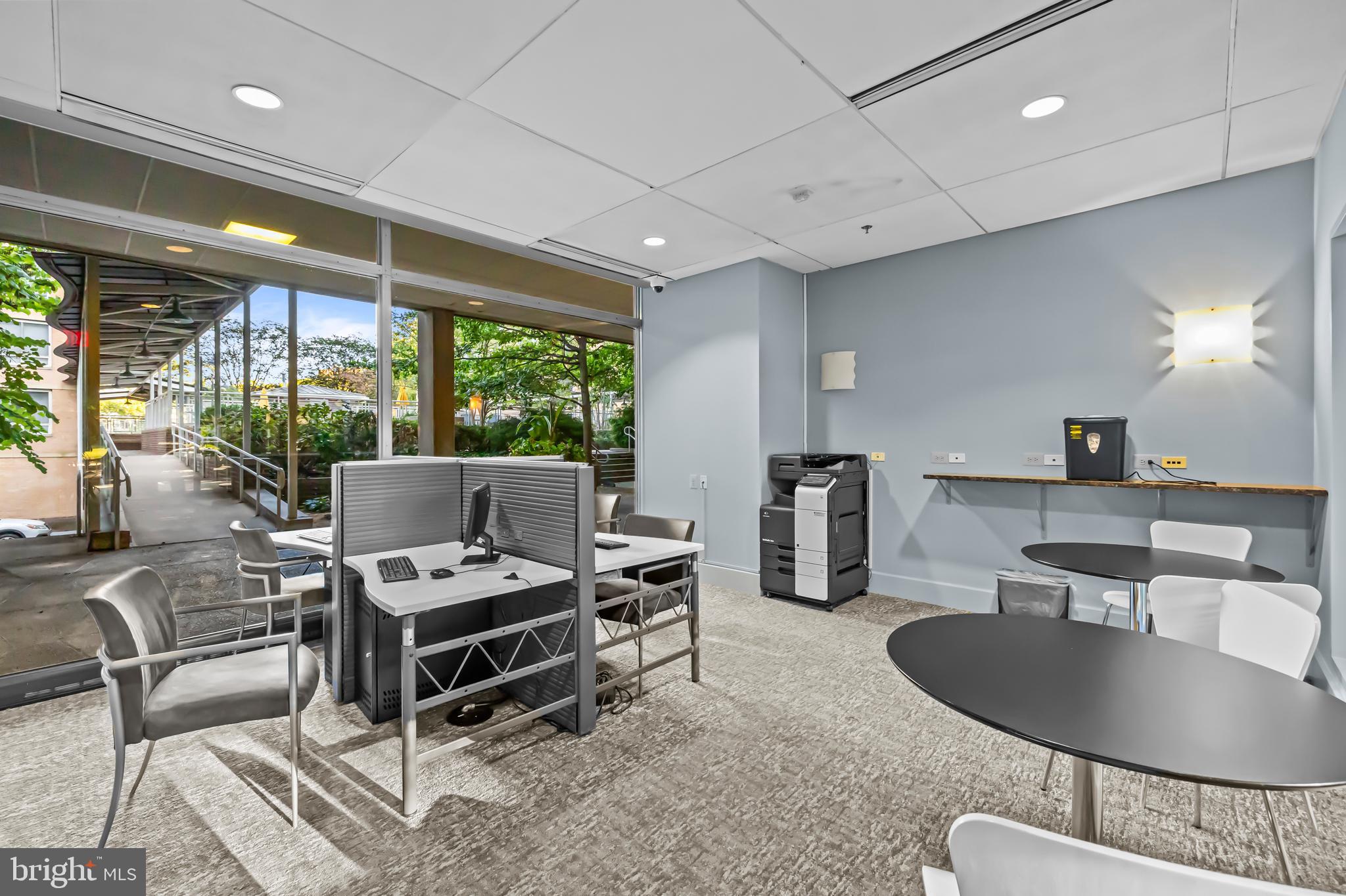 350 G Street Southwest, Unit N614 Washington, DC 20024 - Photo 21 of 35 a room with furniture a window and a chandelier