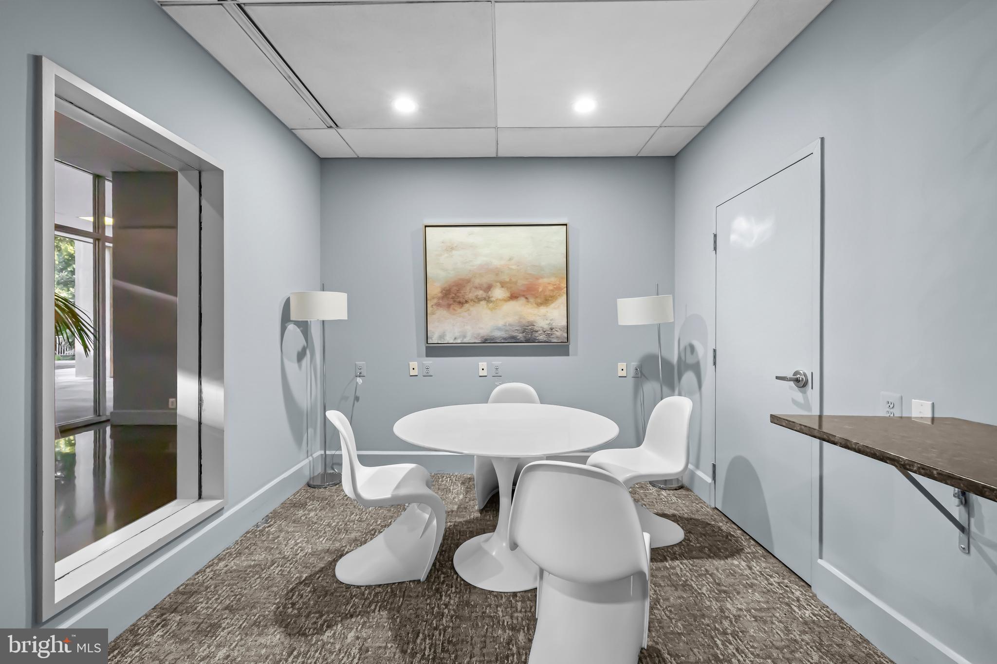 350 G Street Southwest, Unit N614 Washington, DC 20024 - Photo 22 of 35 a dining room with furniture and a chandelier