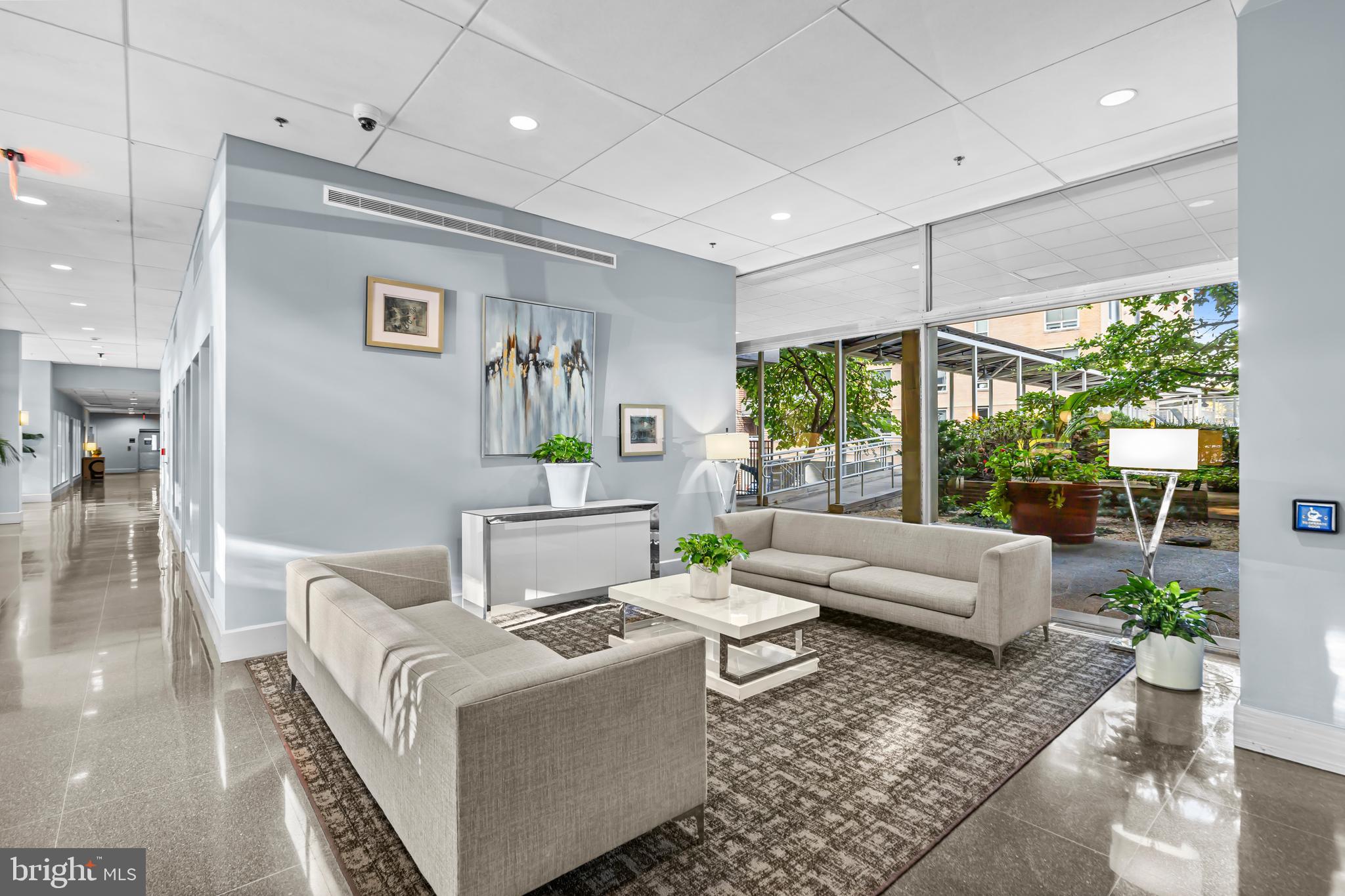 350 G Street Southwest, Unit N614 Washington, DC 20024 - Photo 27 of 35 a living room with furniture and a large window