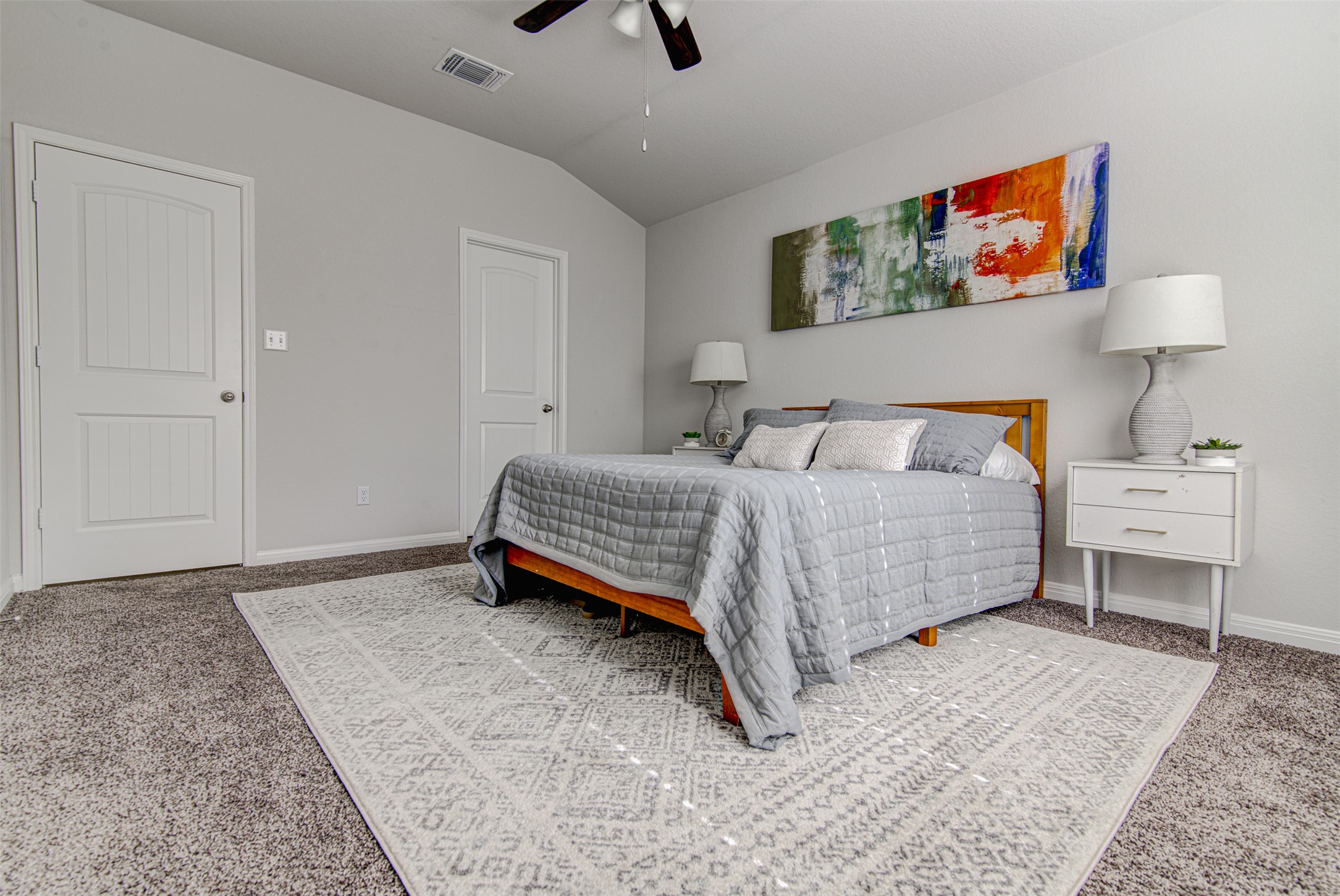 316 Pepper Mill Loop Burnet, TX 78611 - Photo 13 of 27 Relaxation awaits in this inviting primary bedroom, offering ample space and a cozy atmosphere.