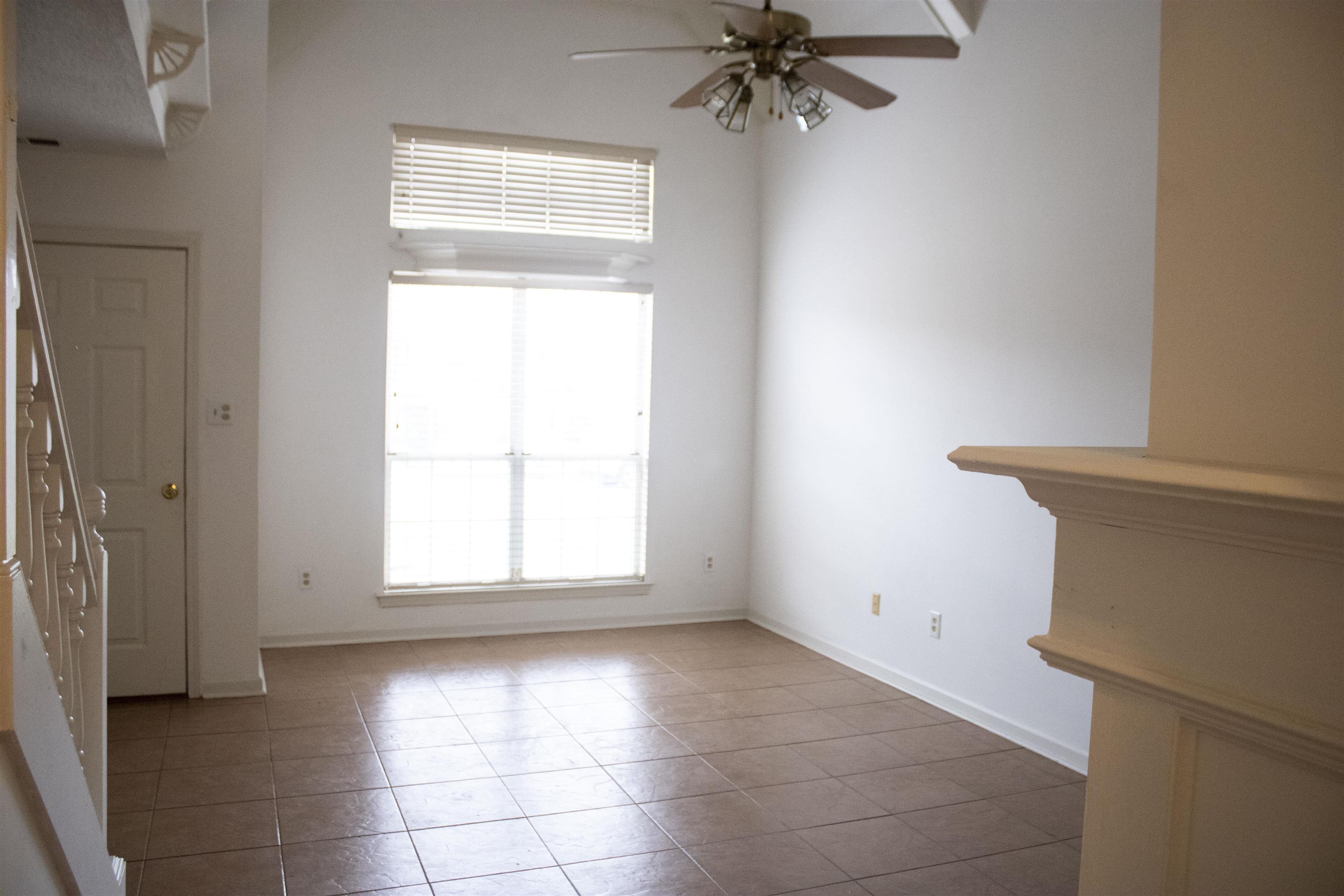 6865 Snyder Road Memphis, TN 38141 - Photo 3 of 10 an empty room with a window