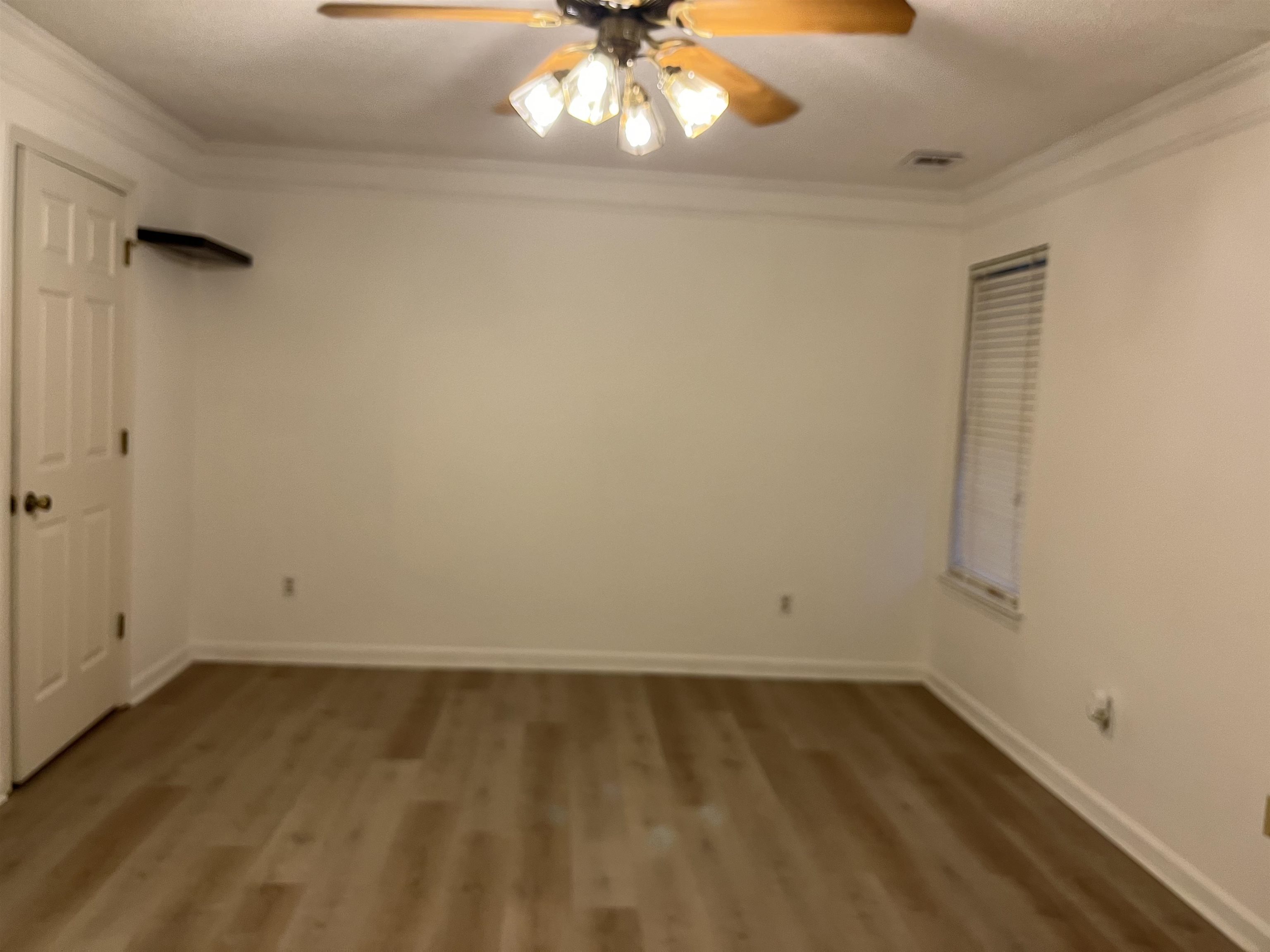 6865 Snyder Road Memphis, TN 38141 - Photo 5 of 10 wooden floor in an empty room
