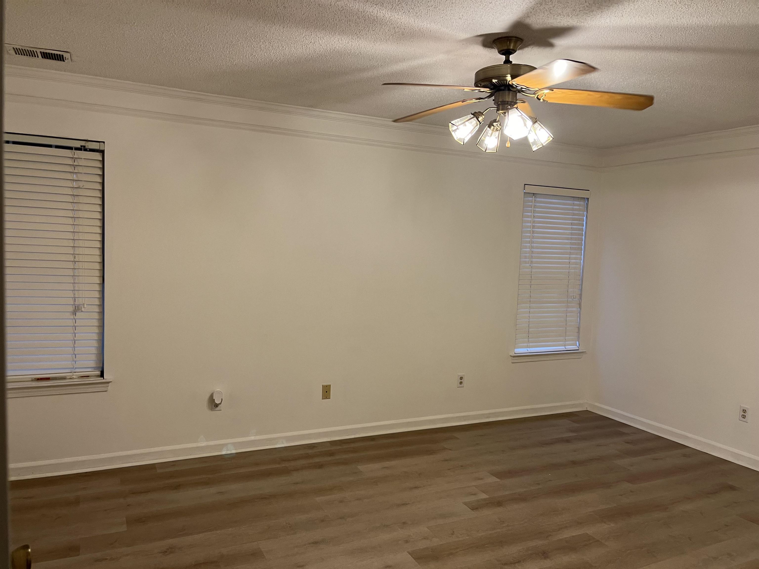 6865 Snyder Road Memphis, TN 38141 - Photo 6 of 10 a view of room with window and wooden floor