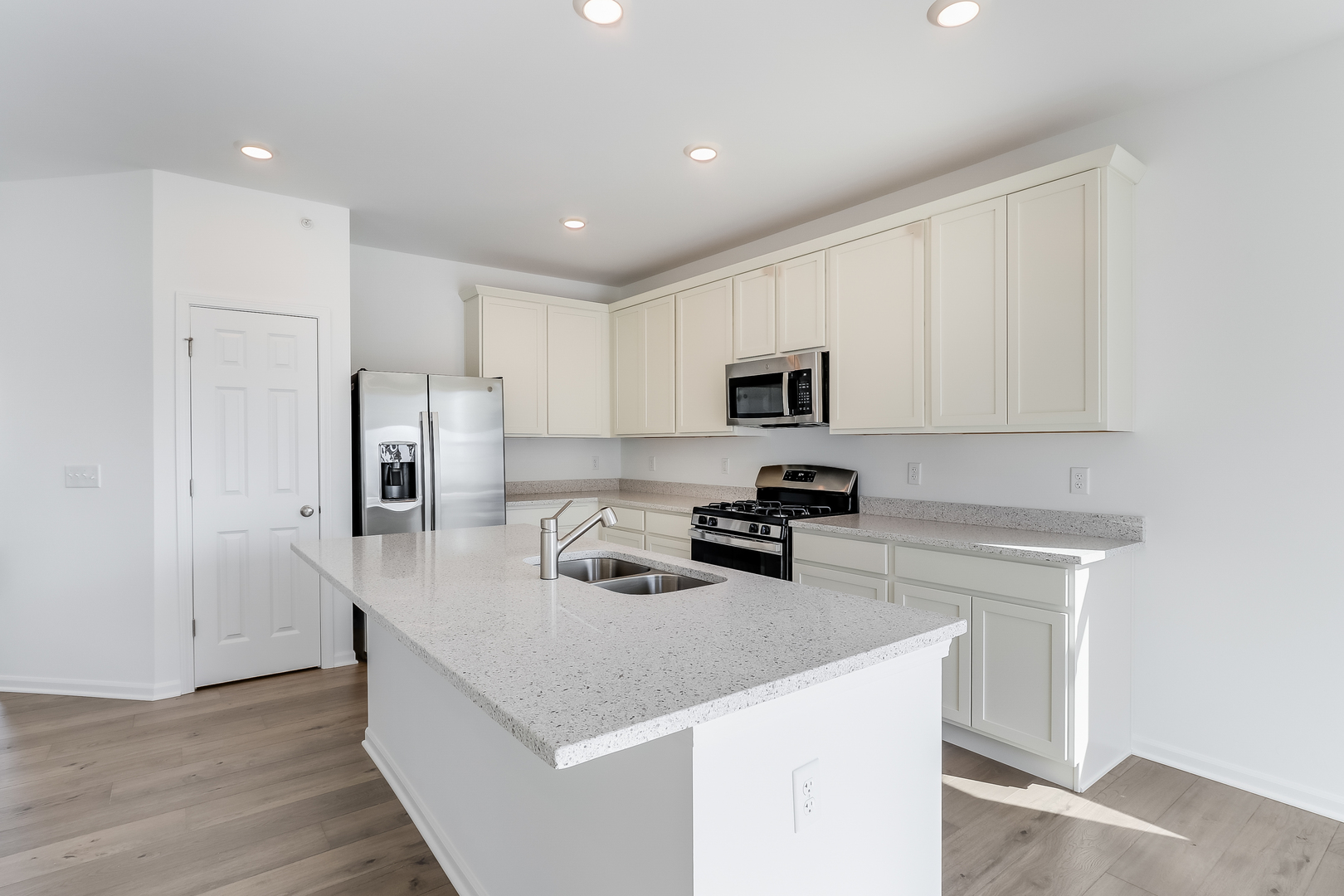 460 Comstock Road South Elgin, IL 60177 - Photo 12 of 31 a kitchen with refrigerator cabinets and wooden floor