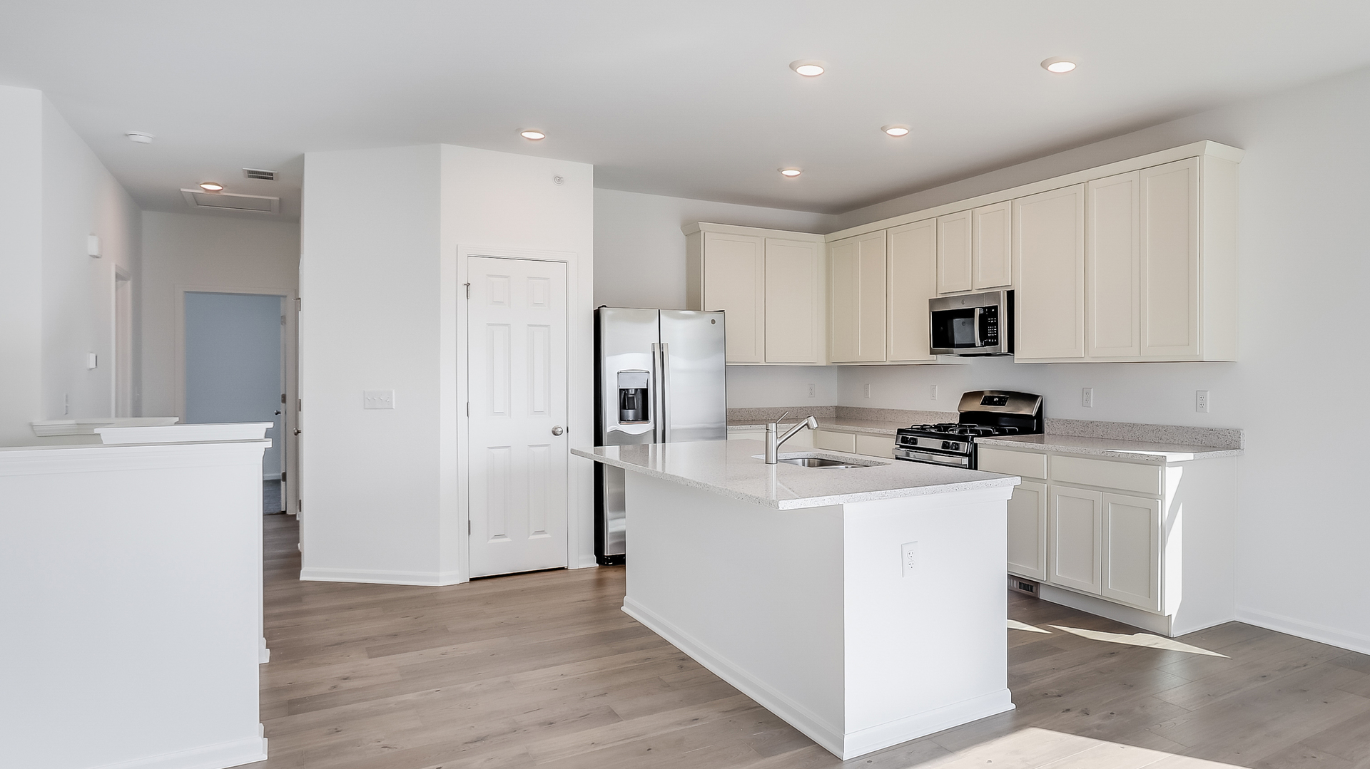 460 Comstock Road South Elgin, IL 60177 - Photo 17 of 31 a kitchen with white cabinets and stainless steel appliances