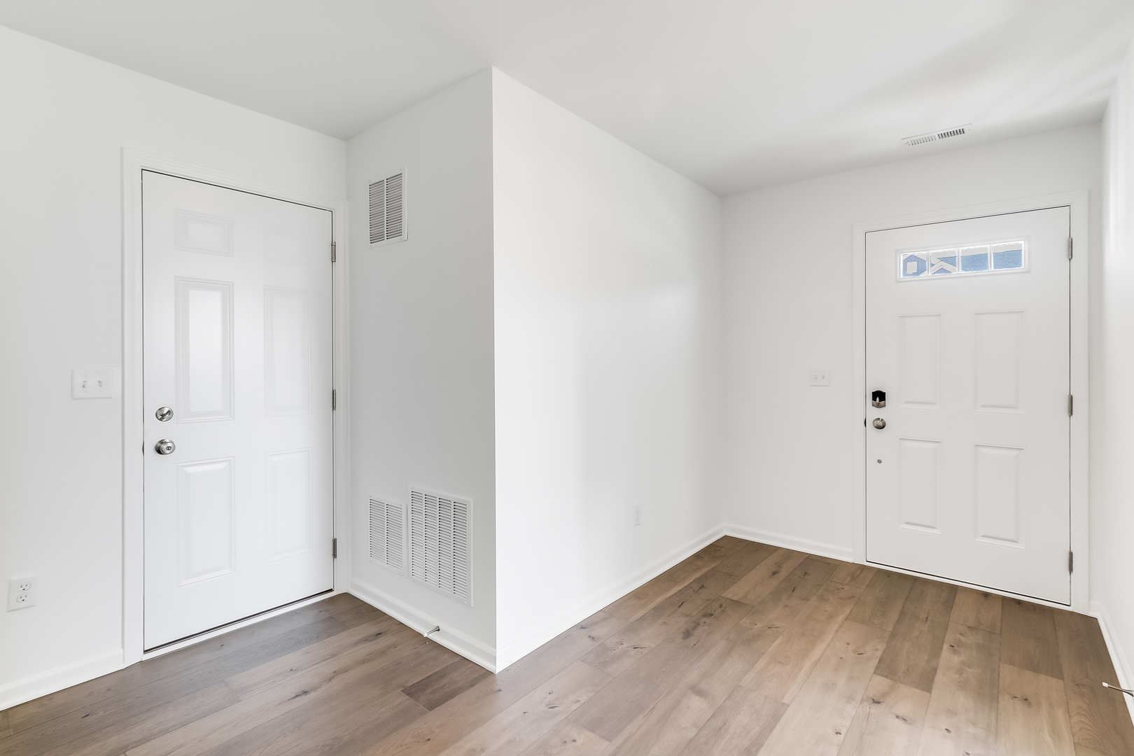 460 Comstock Road South Elgin, IL 60177 - Photo 3 of 31 a view of an empty room with wooden floor