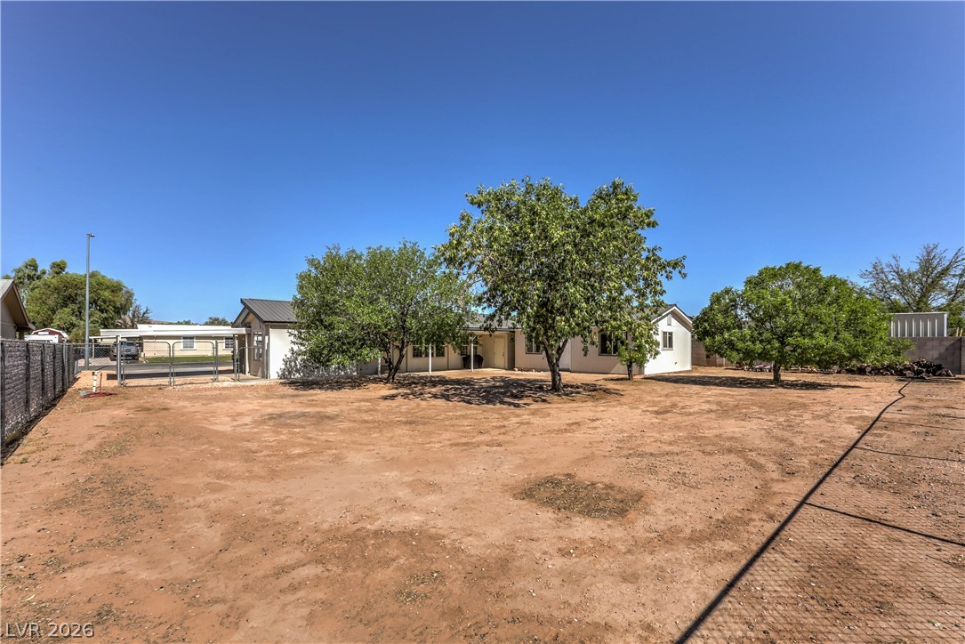 348 Tres Palomas Street Overton, NV 89040 - Photo 38 of 41 A spacious yard surrounds this tranquil desert dwelling with mature shade trees.