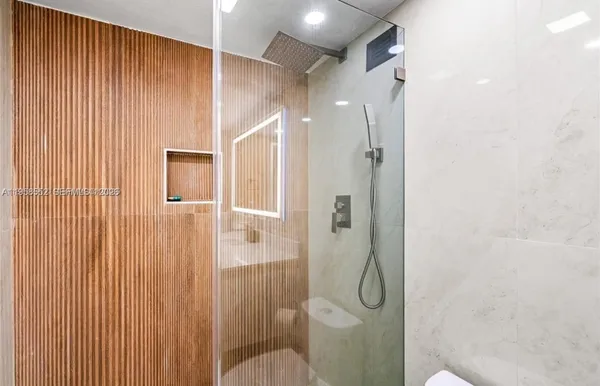 a bathroom with a double vanity sink toilet and a mirror