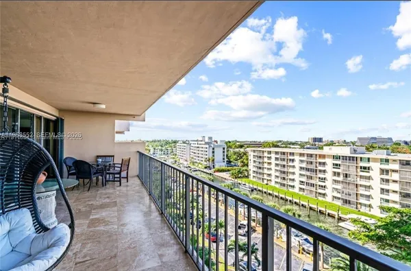a view of balcony with furniture