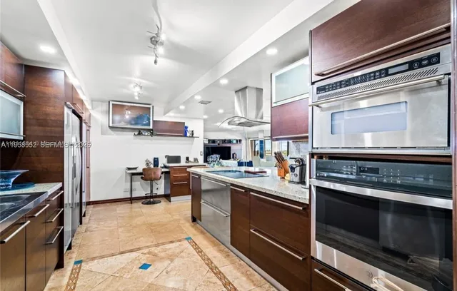 a kitchen with a stove and a microwave
