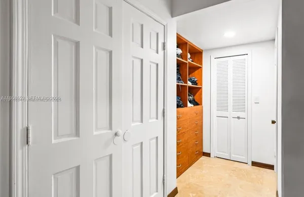 a view of a hallway with white walls