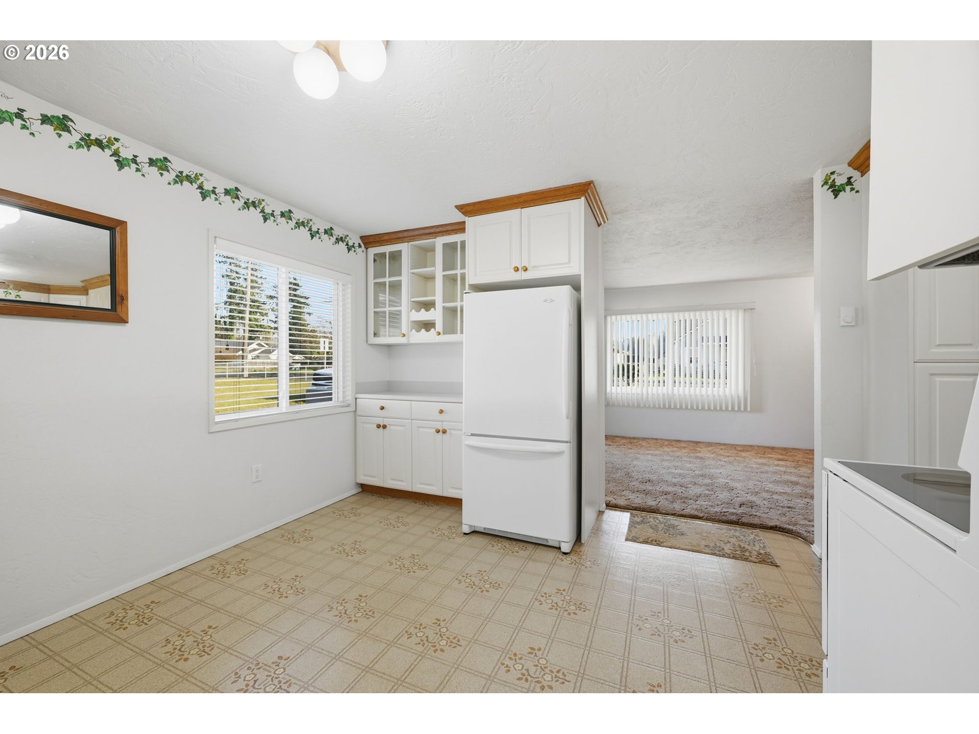 87856 Cedar Flat Road Springfield, OR 97478 - Photo 12 of 37 a kitchen with cabinets and refrigerator