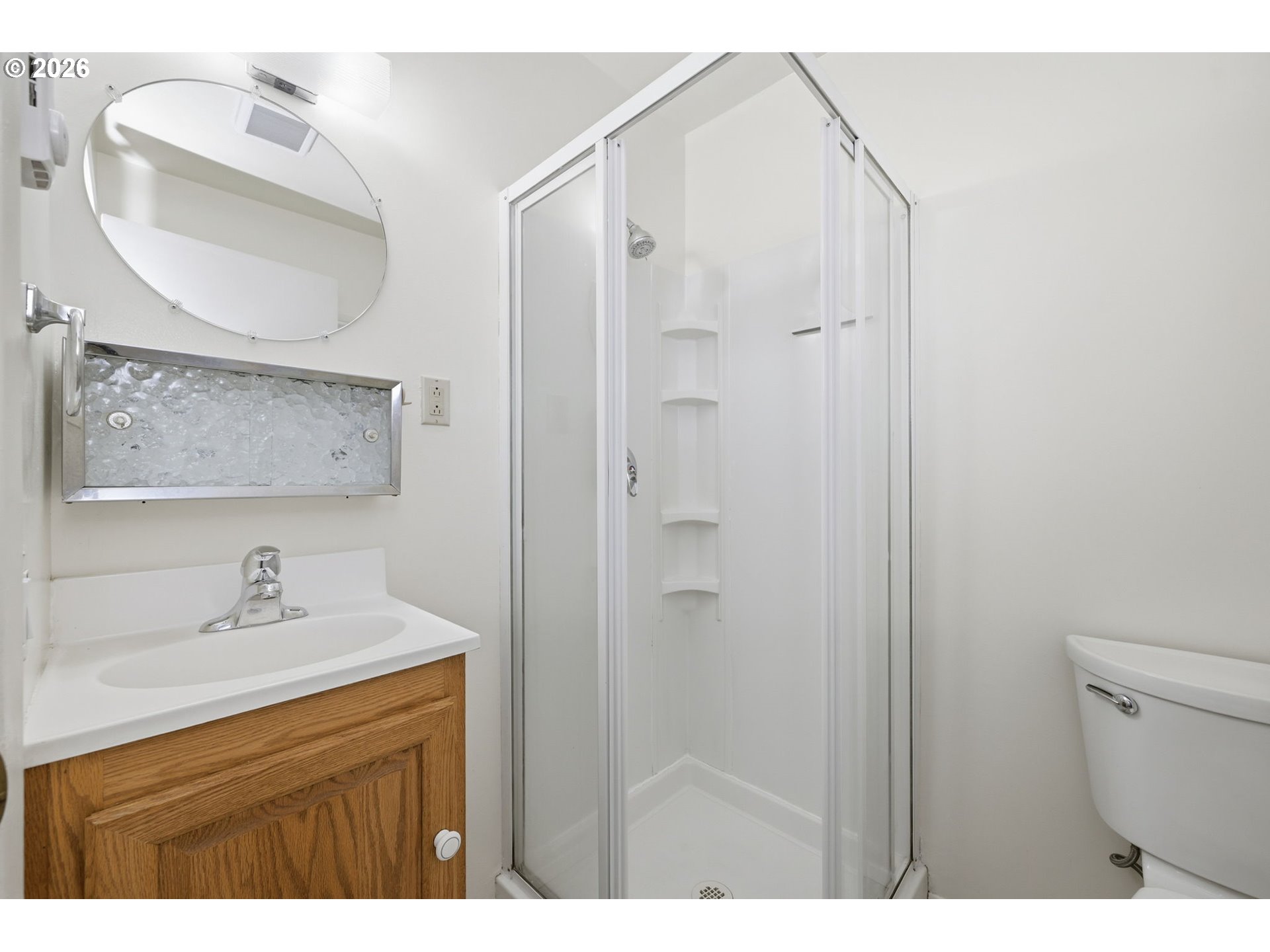 87856 Cedar Flat Road Springfield, OR 97478 - Photo 15 of 37 a bathroom with a sink mirror and a shower