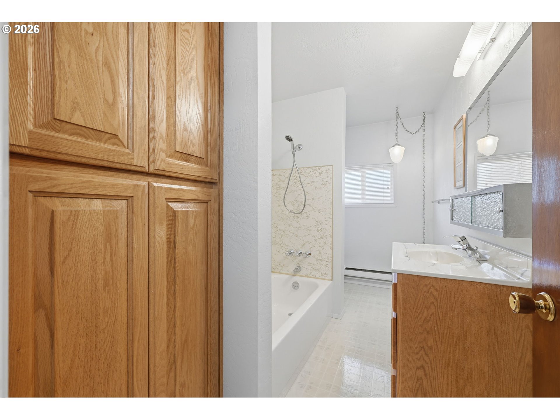 87856 Cedar Flat Road Springfield, OR 97478 - Photo 17 of 37 a bathroom with a granite countertop sink a mirror and a bathtub