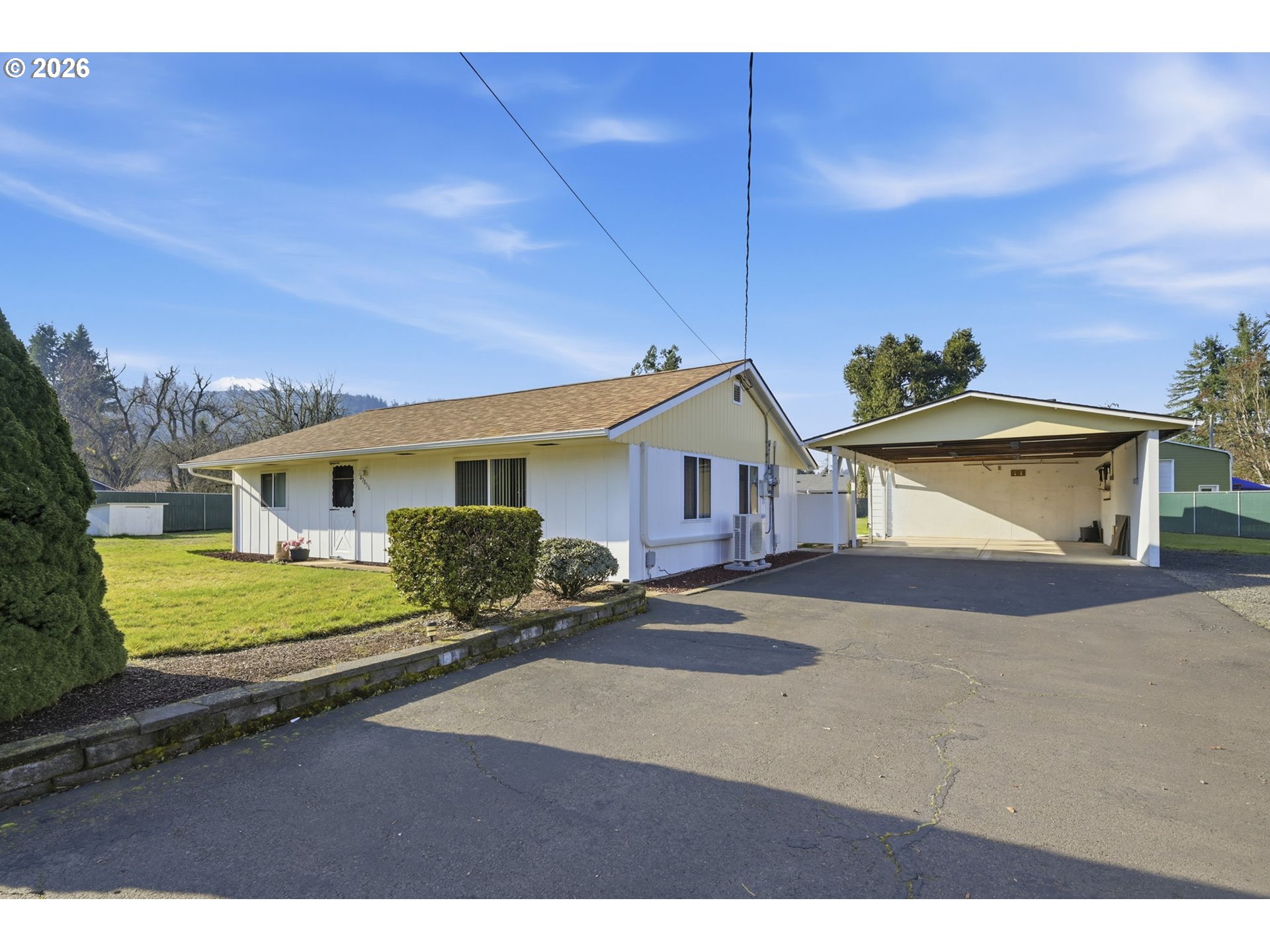 87856 Cedar Flat Road Springfield, OR 97478 - Photo 2 of 37 a front view of a house with a yard and garage