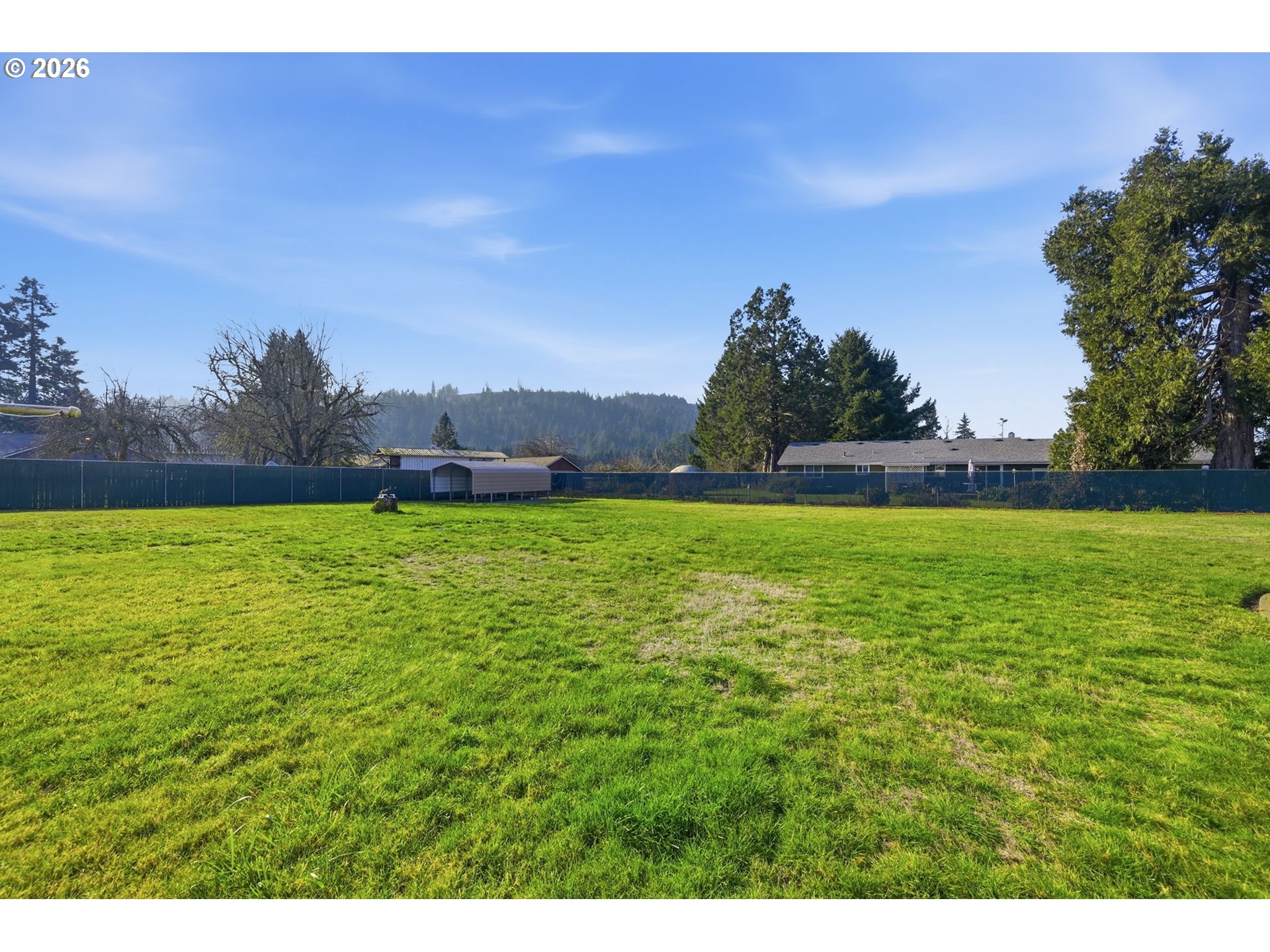 87856 Cedar Flat Road Springfield, OR 97478 - Photo 21 of 37 a backyard of a house with lots of green space