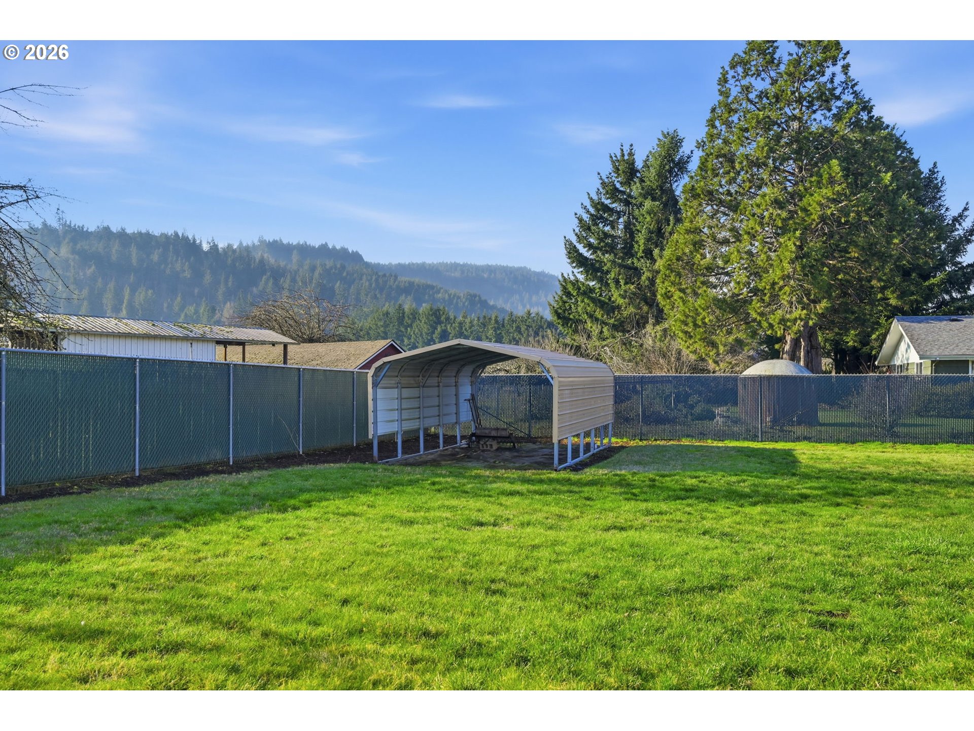 87856 Cedar Flat Road Springfield, OR 97478 - Photo 24 of 37 a view of a backyard with a garden