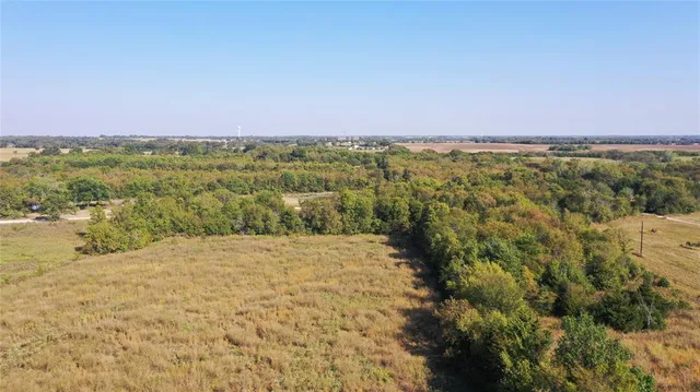 a view of a field with an outdoor space