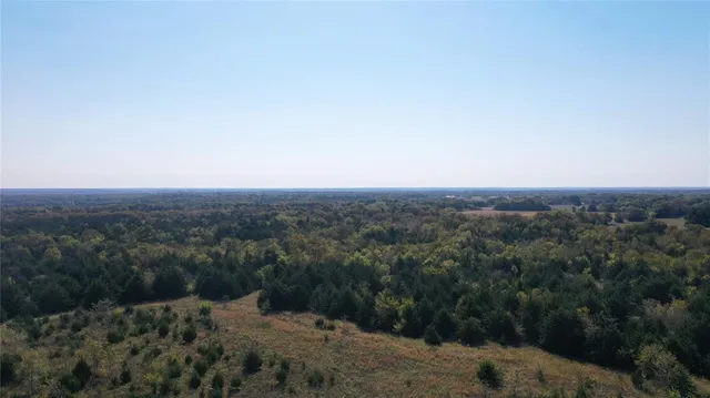 an aerial view of residential house and green space