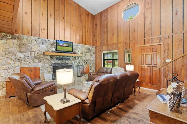 a view of a backyard with a garden and entertaining space