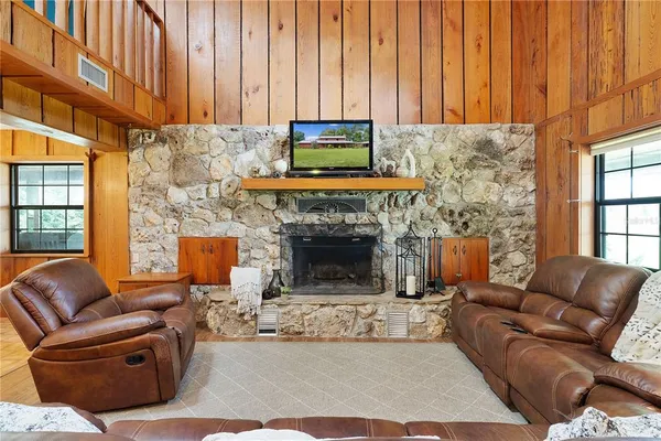 a spacious bedroom with a large bed and a large window