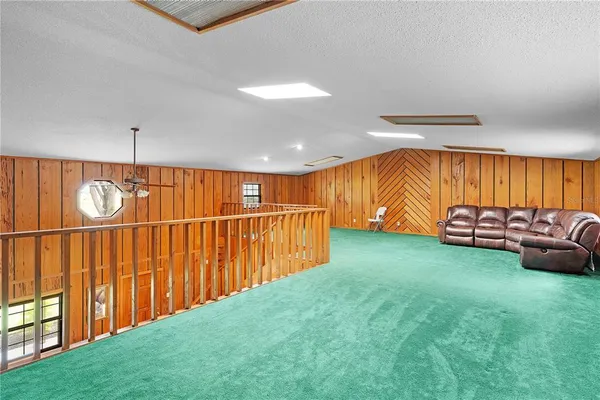 a bathroom with a sink and mirror with toilet