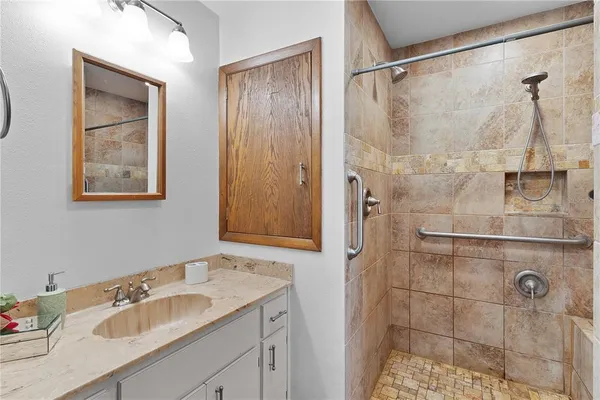 a view of a house with a backyard and a chair