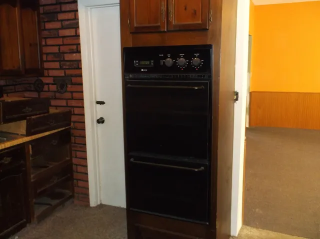 a kitchen with a sink and a stove