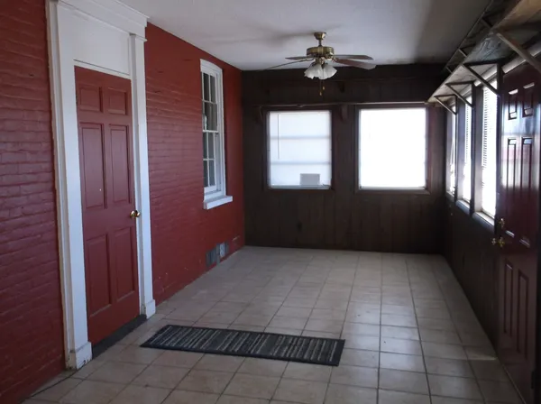 a view of empty room with a fireplace
