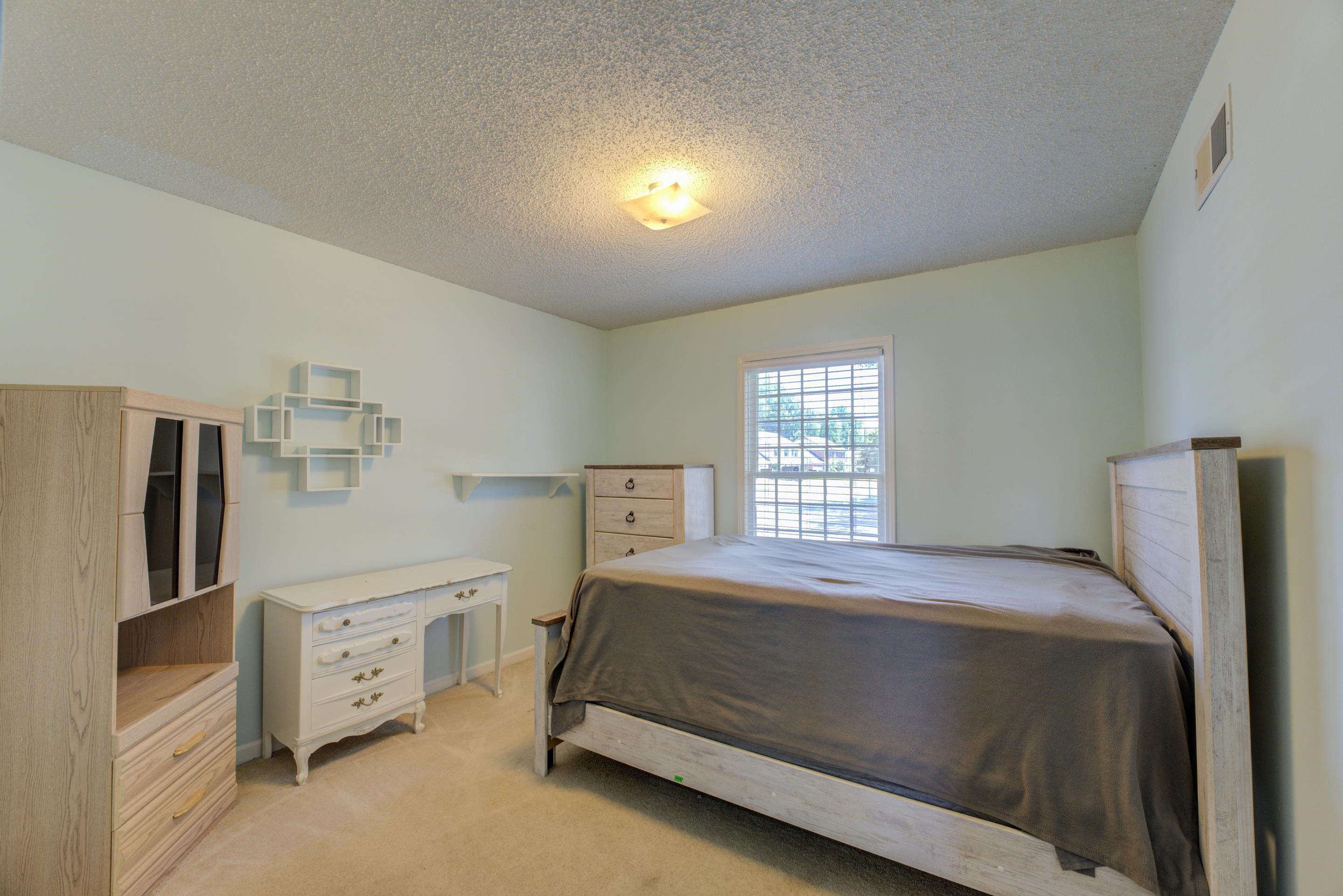 2031 Corbin Road Germantown, TN 38139 - Photo 11 of 27 Carpeted bedroom with a textured ceiling