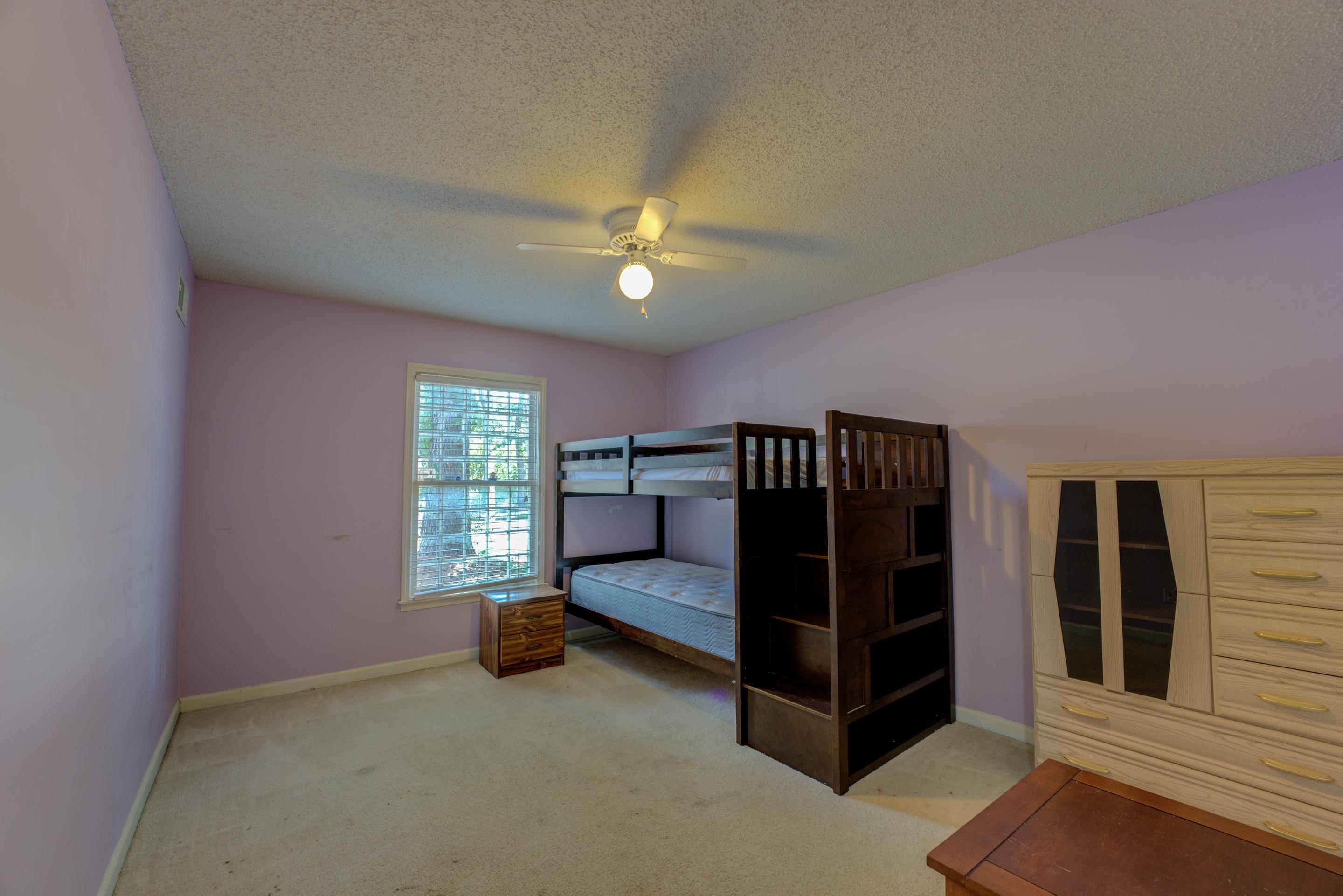 2031 Corbin Road Germantown, TN 38139 - Photo 12 of 27 Unfurnished bedroom featuring a textured ceiling, ceiling fan, and light carpet