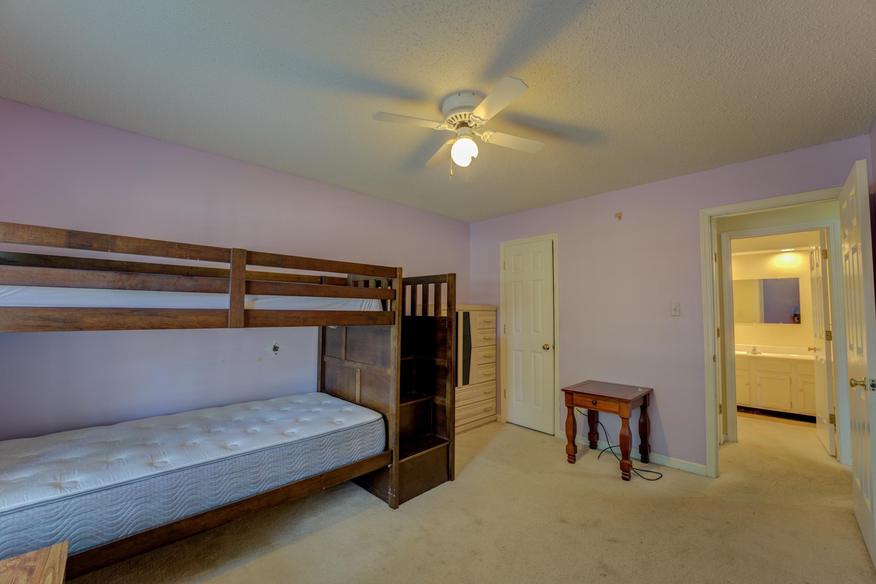 2031 Corbin Road Germantown, TN 38139 - Photo 13 of 27 Carpeted bedroom with ceiling fan and a textured ceiling