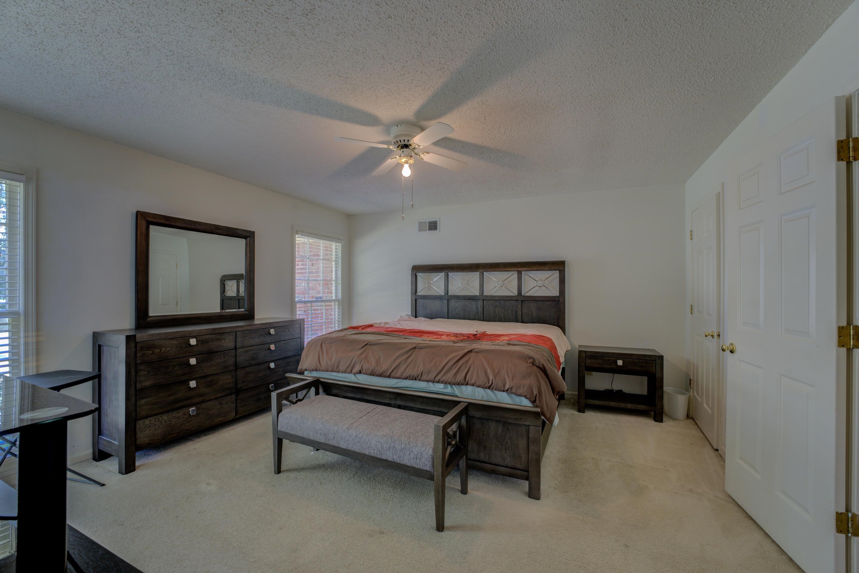 2031 Corbin Road Germantown, TN 38139 - Photo 15 of 27 Carpeted bedroom with a textured ceiling and ceiling fan