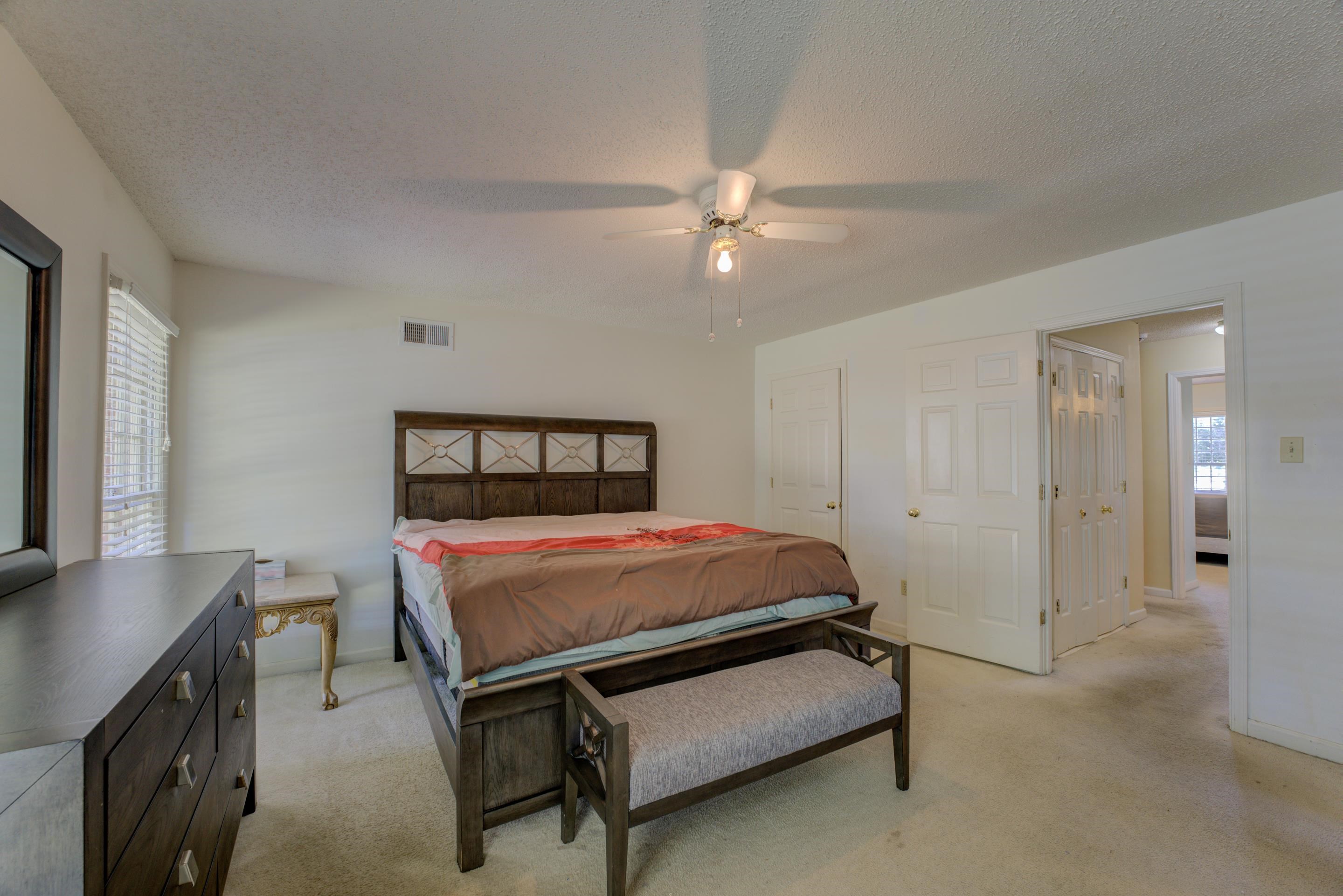 2031 Corbin Road Germantown, TN 38139 - Photo 16 of 27 Bedroom with a textured ceiling, ceiling fan, and light carpet