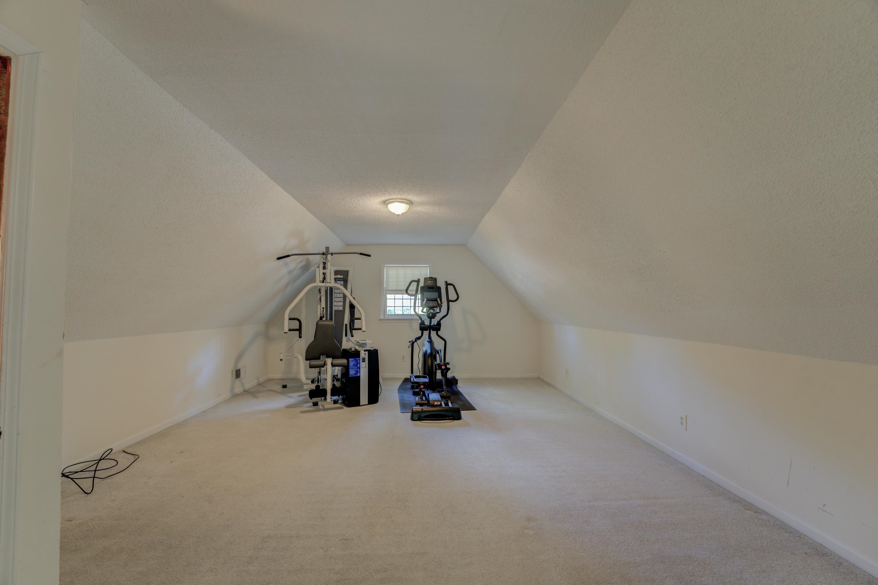 2031 Corbin Road Germantown, TN 38139 - Photo 20 of 27 Exercise room with vaulted ceiling and carpet