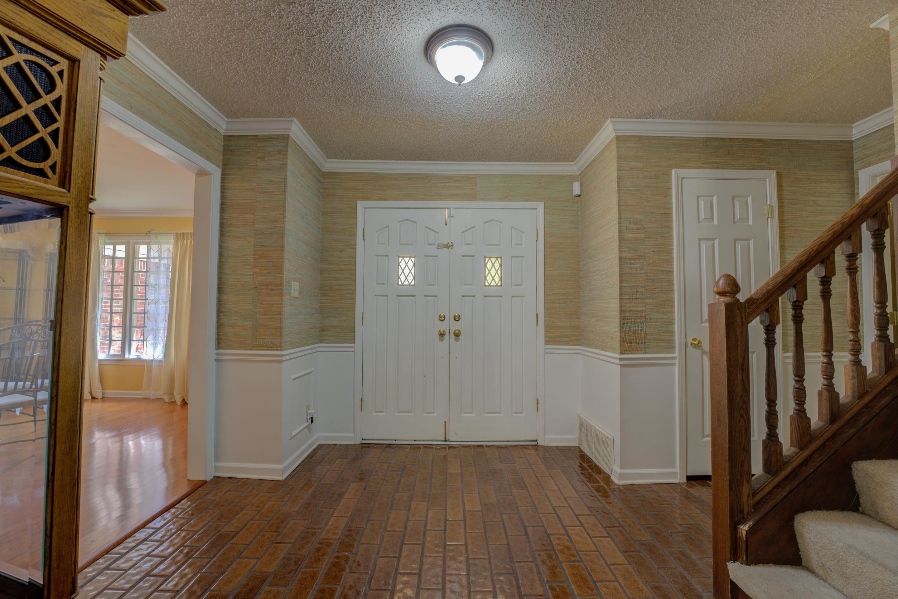 2031 Corbin Road Germantown, TN 38139 - Photo 2 of 27 Entryway featuring a textured ceiling and ornamental molding