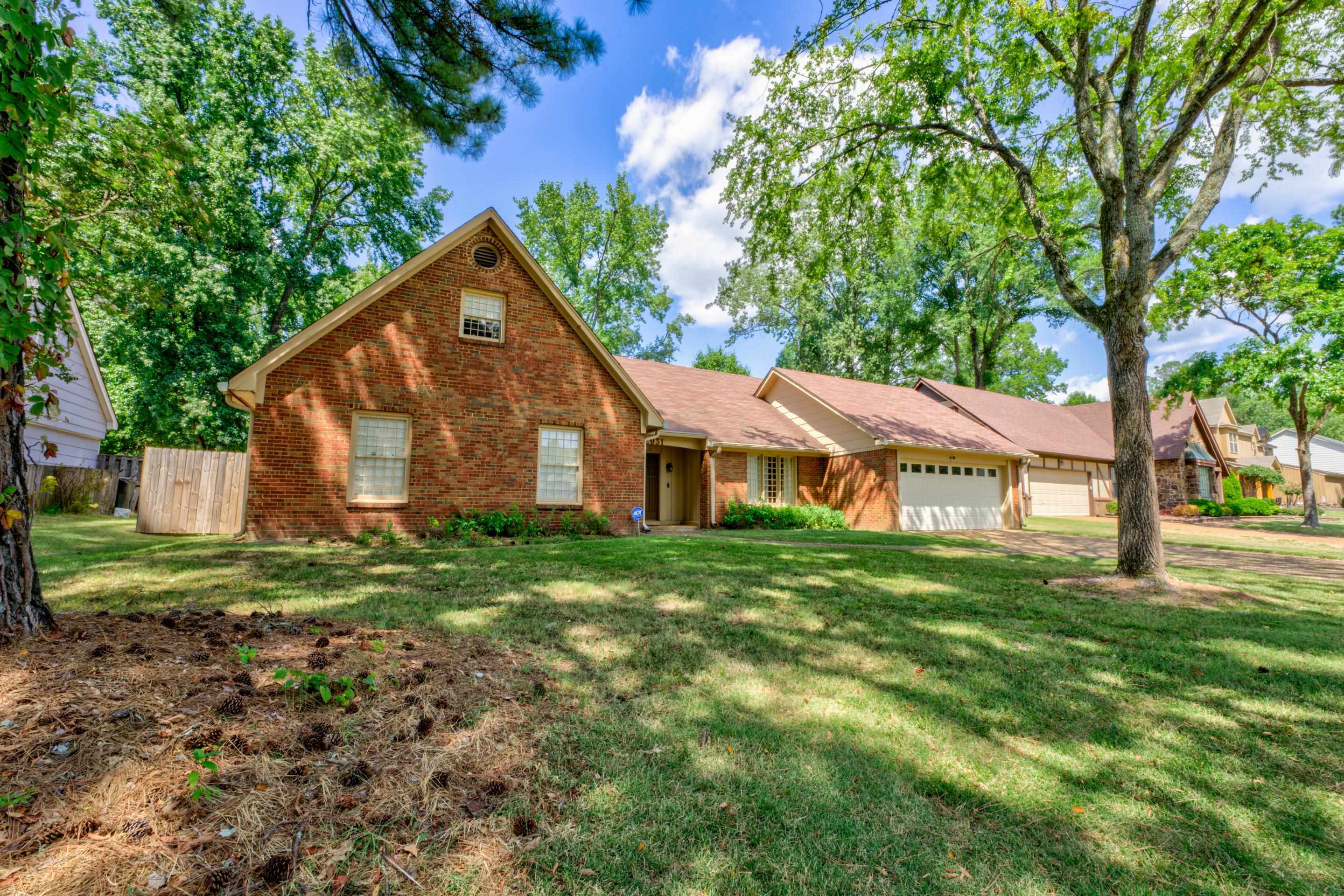 2031 Corbin Road Germantown, TN 38139 - Photo 26 of 27 View of front of house featuring a front lawn and a garage