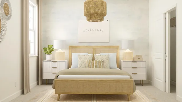 a bedroom with a bed and painting on the wall