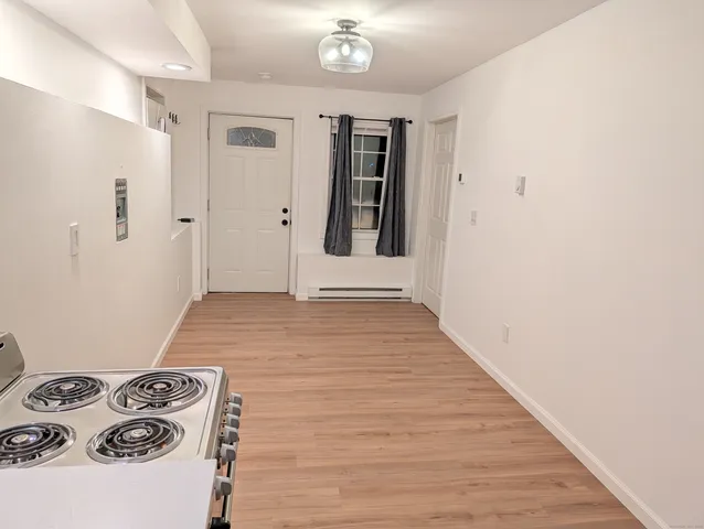 a view of a livingroom with wooden floor